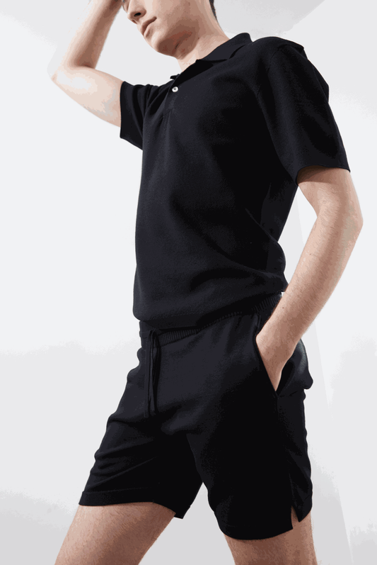 Cane Short in black with ribbed elastic waistband and side pockets.