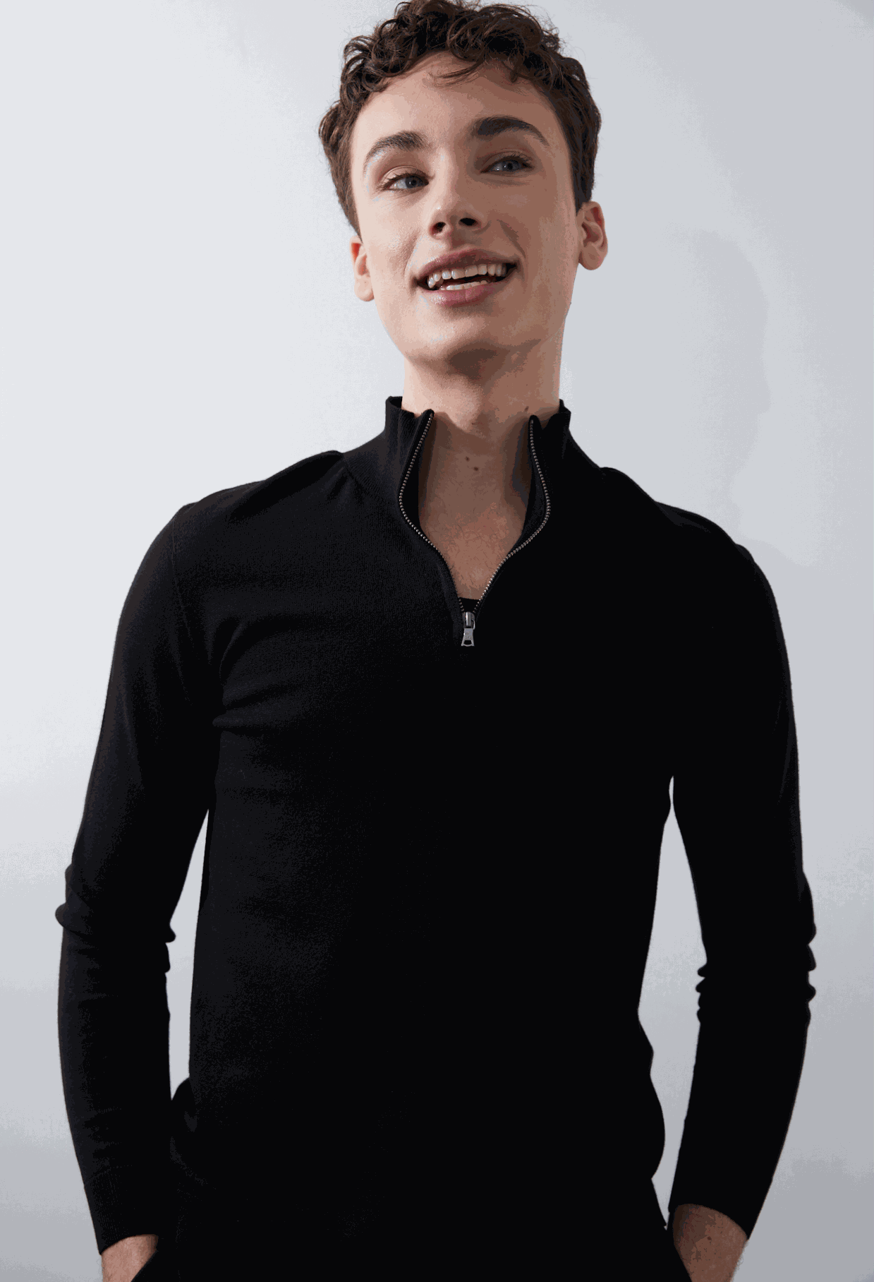 Nash Zip Pullover in black, featuring a quarter zip collar and ribbed cuffs, made from eco-friendly EcoViscose.