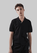 Nix Polo in black modeled, classic design, eco-friendly fabric.