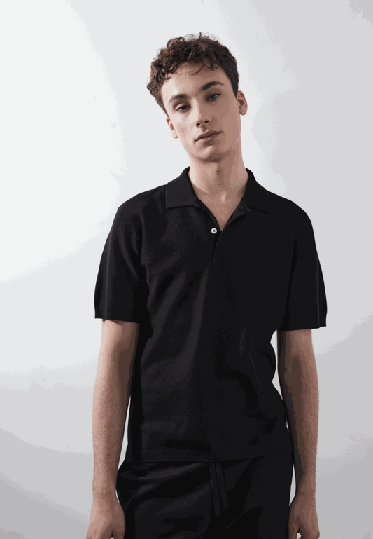 Nix Polo in black modeled, classic design, eco-friendly fabric.