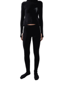 Arca Legging in black worn with matching top, showcasing a seamless and sleek design.