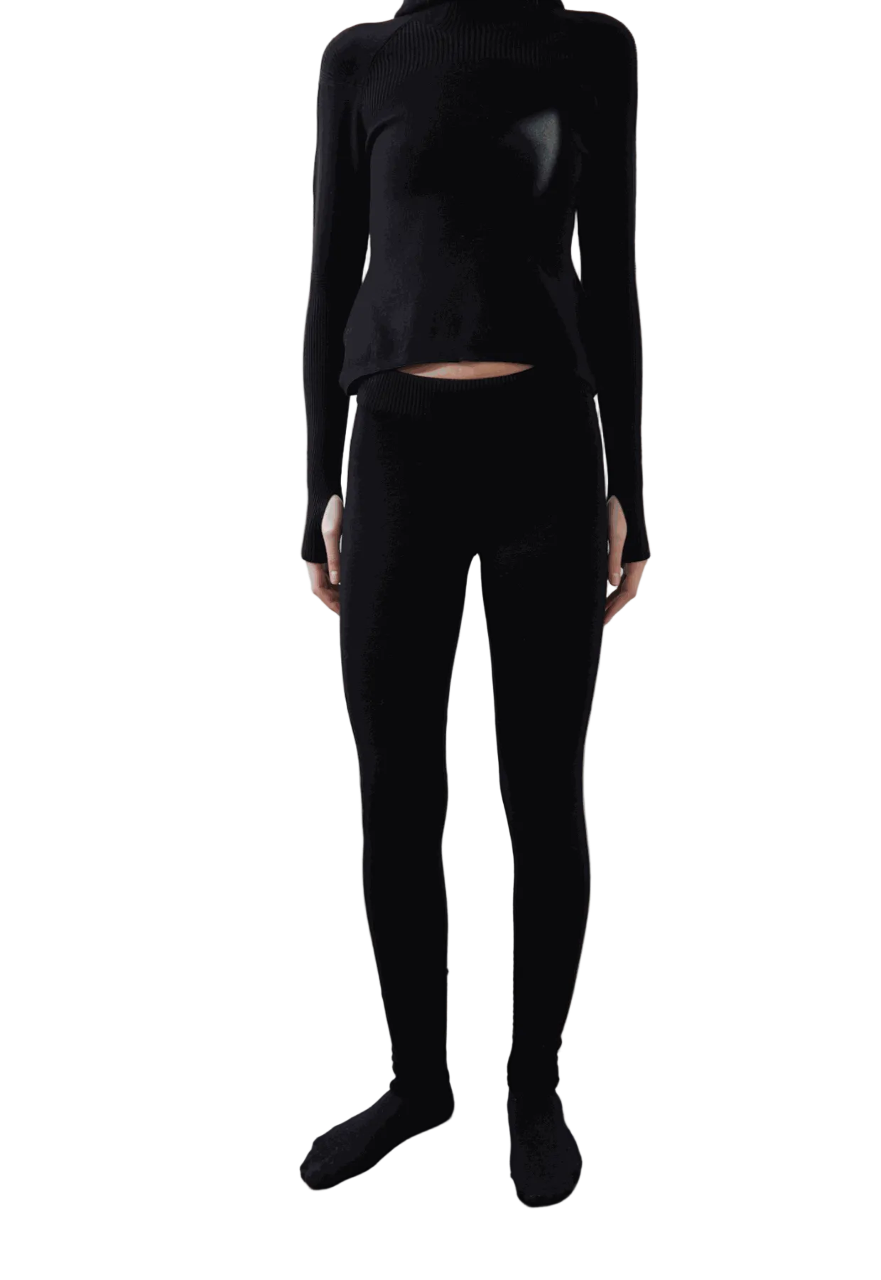 Arca Legging in black worn with matching top, showcasing a seamless and sleek design.