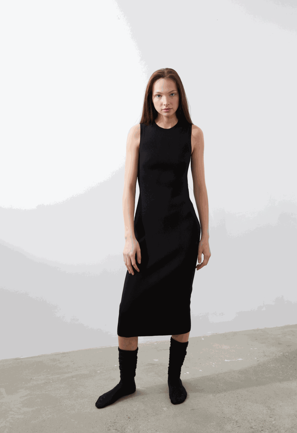 Naza Dress in black, sleeveless midi design, featuring heavyweight ribbing for structure and a 3D textile seamless construction.