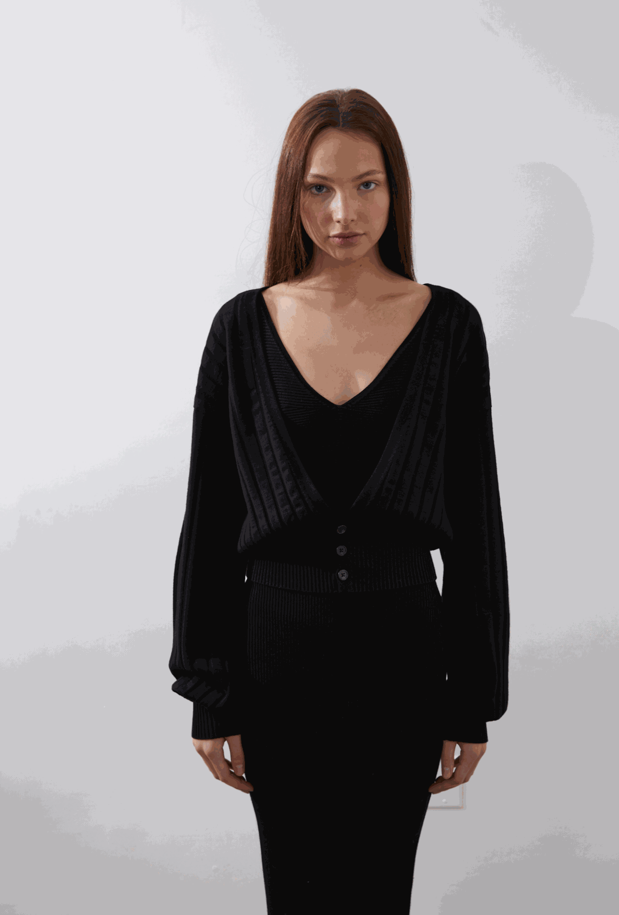 Seren Cardigan in black with deep V-neckline and billowing sleeves.