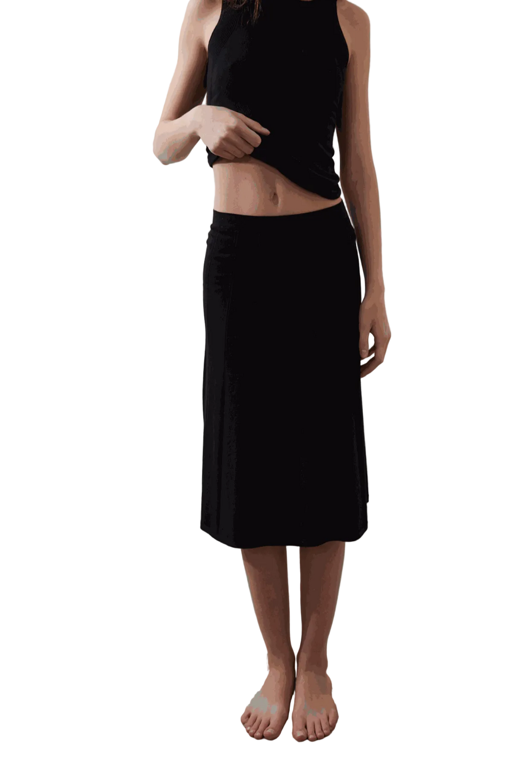 Vega Skirt in black with subtle pleated texture and sleek waist fit.