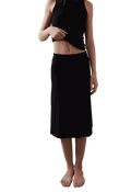 Vega Skirt in black with subtle pleated texture and sleek waist fit.