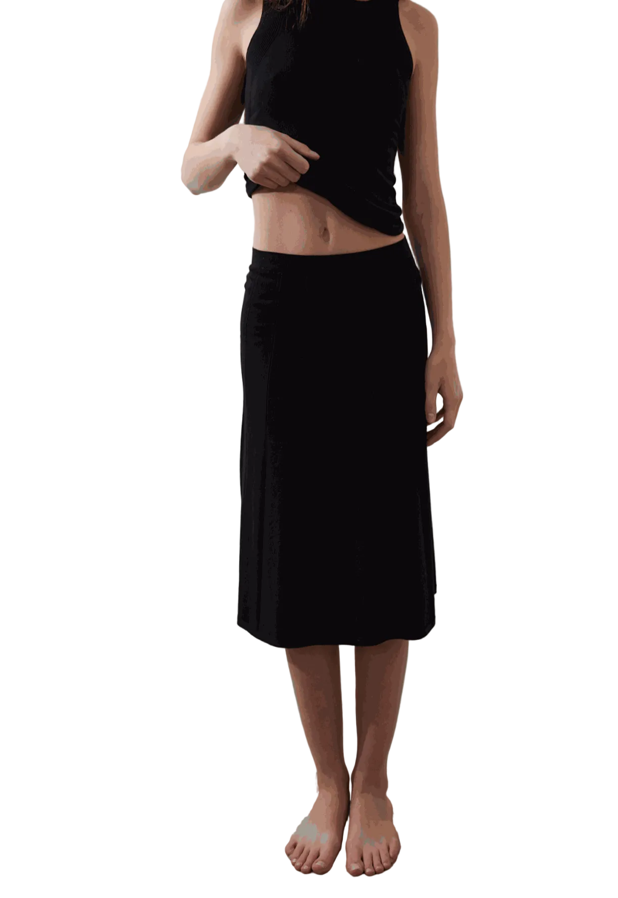 Vega Skirt in black with subtle pleated texture and sleek waist fit.